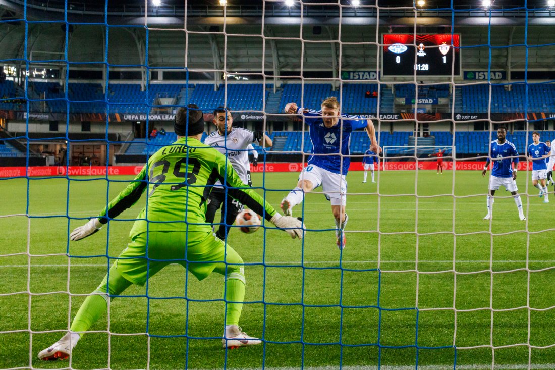 Kristian Eriksen setter ballen forbi keeper Andrey Lunev og utlikner til 1-1. Foto: Svein Ove Ekornesvåg / NTB